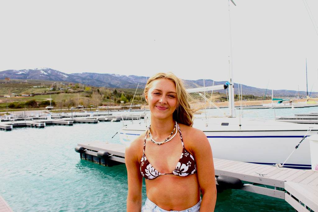 White puka shell necklace with natural clam shells product view