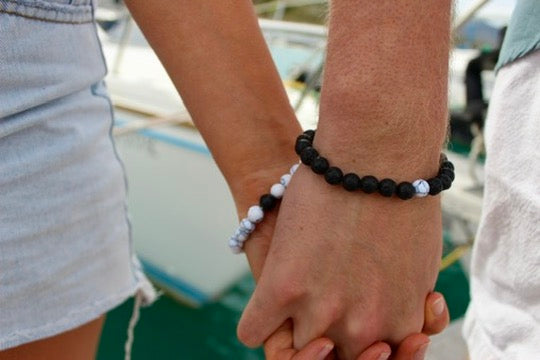 Black lava bead bracelet with white stone accents close-up