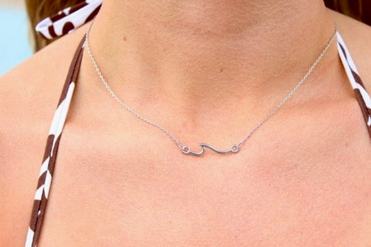 Open wave pendant necklace with polished finish detail view