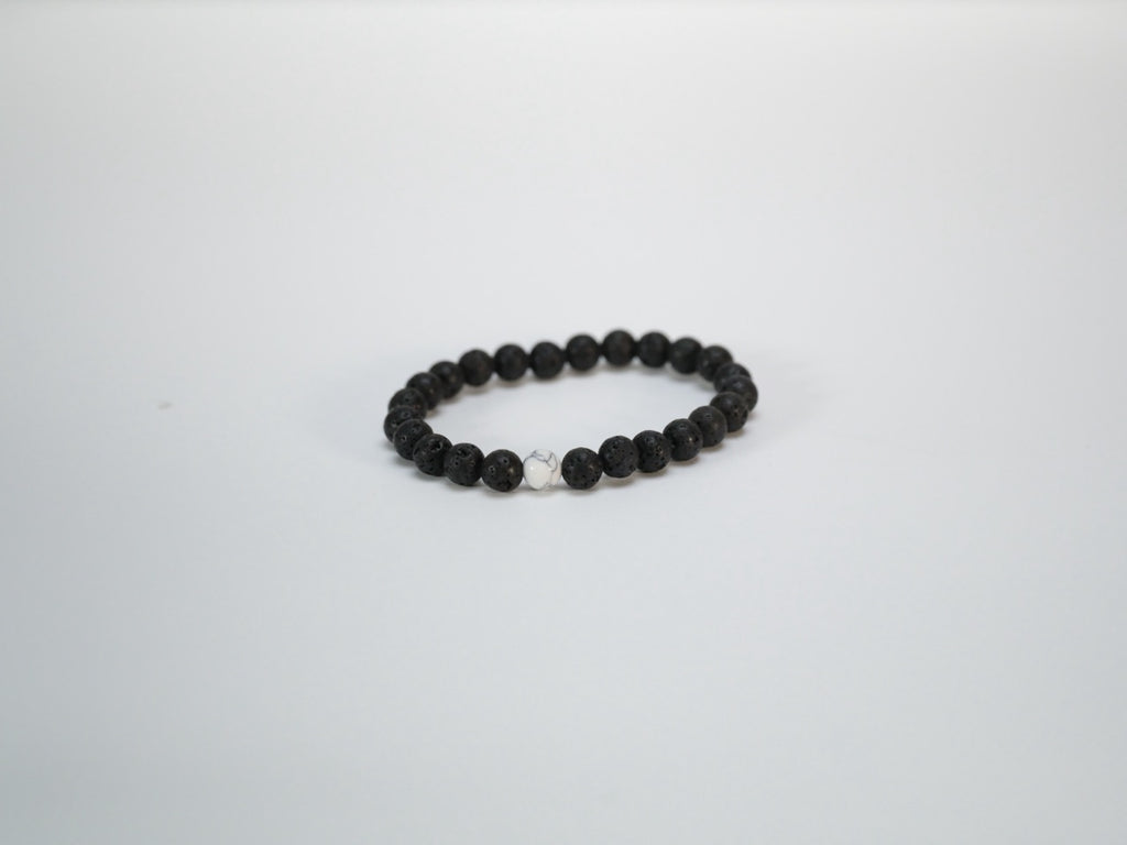 Black lava bead bracelet with white stone accents product view
